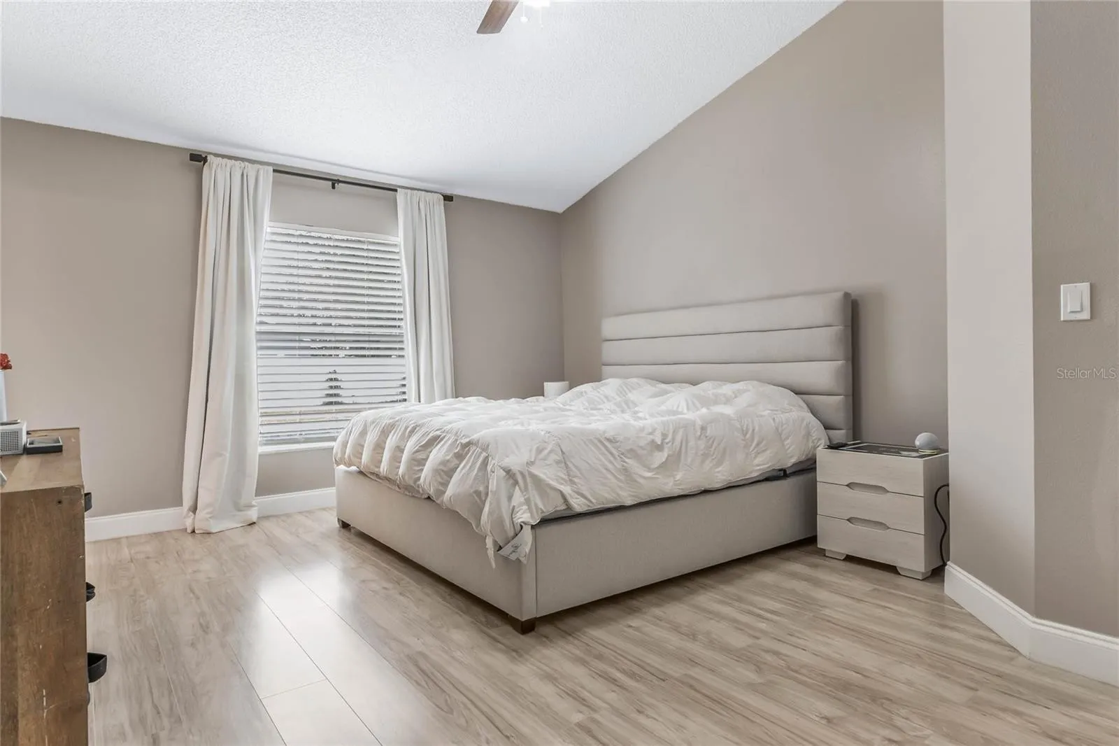 renovated bedroom with large queen bed